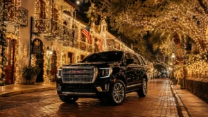 A sleek luxury black chauffeur SUV navigating slowly through the spectacular three million white Christmas lights illuminating the historic district of St. Augustine, Florida.
